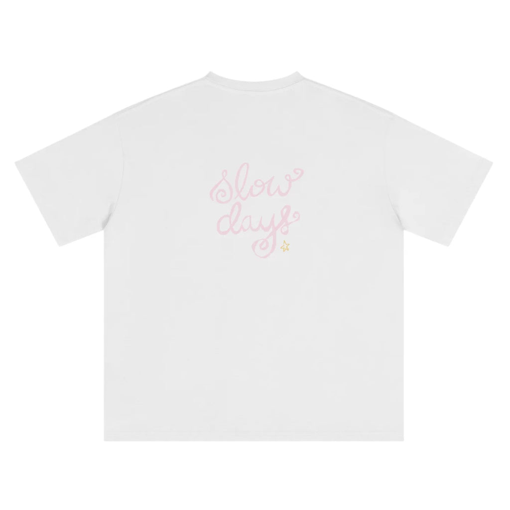 Wipe Away Slow Days graphic tee – Cloud Dancer white,  with hand-drawn print. Back view, relaxed oversized silhouette