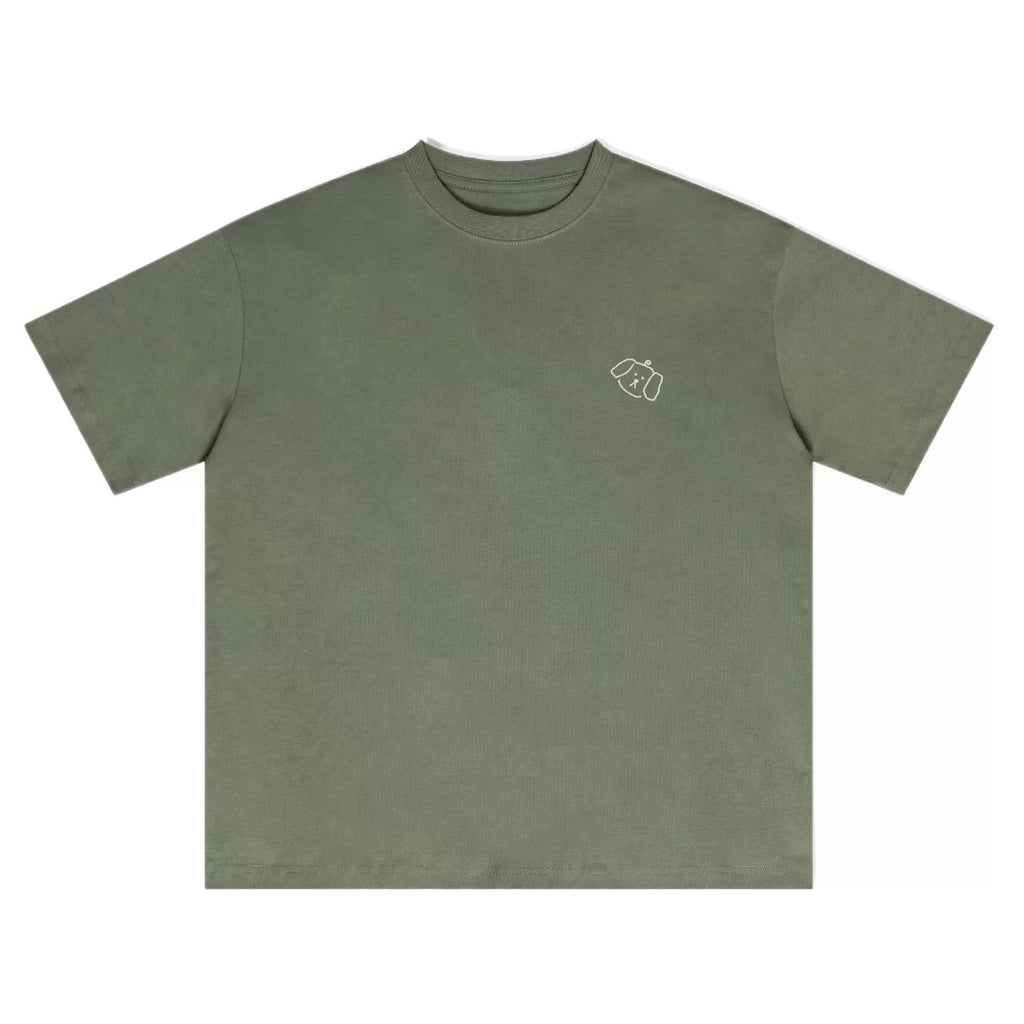 Wipe Away Slow Days tee – Sage Green front view, with small puppy graphic print 